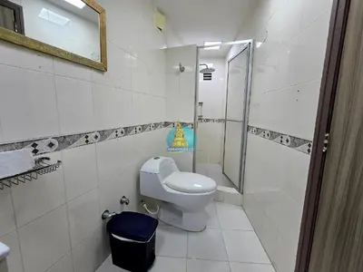 a bathroom with a toilet and a shower at Apto Vista Lateral Mar Piso 15 in Cartagena de Indias