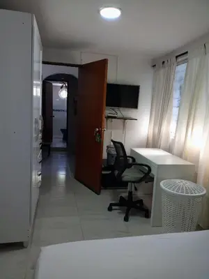 an office with a desk and a chair and a table at Alojamiento San Felipe in Cartagena de Indias