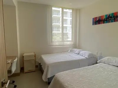 a bedroom with two beds and a window at Espectacular frente al Mar- Morros Zoe - Playa Manzanillo Cartagena in Cartagena de Indias