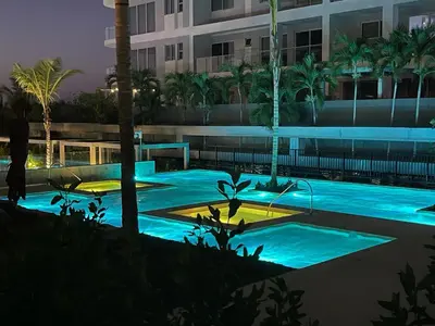 a swimming pool with blue lights in a building at Espectacular frente al Mar- Morros Zoe - Playa Manzanillo Cartagena in Cartagena de Indias