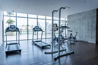 a gym with treadmills and exercise bikes in a building at Apartamento en Bocagrande Cartagena in Cartagena de Indias