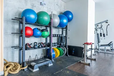 a gym with a bunch of balls and weights at Apartamento en Bocagrande Cartagena in Cartagena de Indias