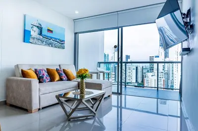 a living room with a couch and a table at Apartamento en Bocagrande Cartagena in Cartagena de Indias