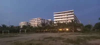 a tall building with a soccer field in front of it at Apto morroszoe 217A in Cartagena de Indias