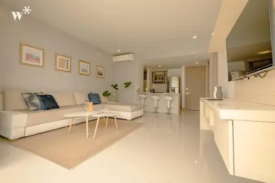 a white living room with a couch and a table at Wynwood Morros Eco in Cartagena in Cartagena de Indias
