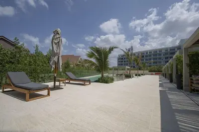 a statue of a woman standing next to two chairs at Wynwood Morros Eco in Cartagena in Cartagena de Indias