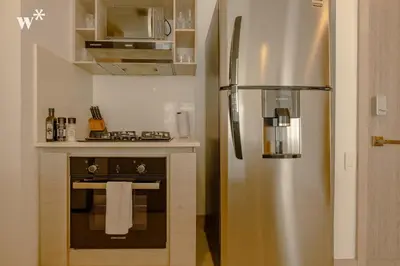 a stainless steel refrigerator in a small kitchen at Wynwood Morros Eco in Cartagena in Cartagena de Indias