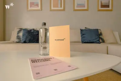 a bottle of wine sitting on a table next to a couch at Wynwood Morros Eco in Cartagena in Cartagena de Indias