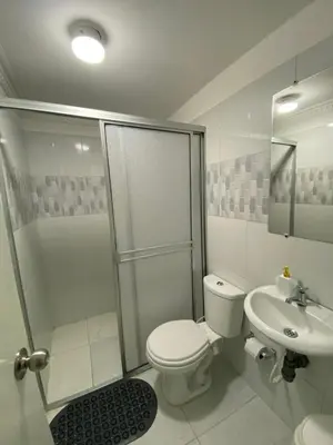 a bathroom with a toilet and a shower and a sink at Habitación cerca al aeropuerto 1 in Cartagena de Indias
