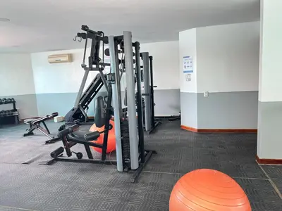 a gym with several tread machines in a room at torres del lago apartamento in Cartagena de Indias