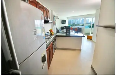 a kitchen with a stainless steel refrigerator in a kitchen at torres del lago apartamento in Cartagena de Indias