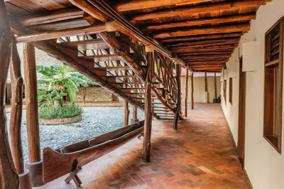 a hallway with wooden stairs in a building at Castillete Hotel & Beach Club in Tierra Bomba