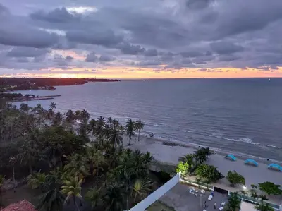 an aerial view of the beach at sunset at Hermoso apartamento con piscina frente al mar - Primera Ensenada in Coveñas