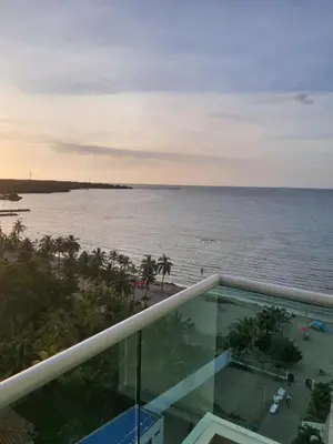 a view of the ocean from the balcony of a resort at Hermoso apartamento con piscina frente al mar - Primera Ensenada in Coveñas