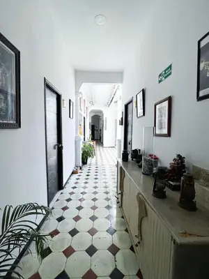 a hallway with a tiled floor in a building at HOSTEL M&H in Cartagena de Indias