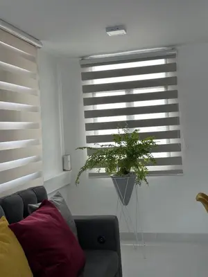 a living room with a couch and a window at Apartasuites Mardini in Cartagena de Indias
