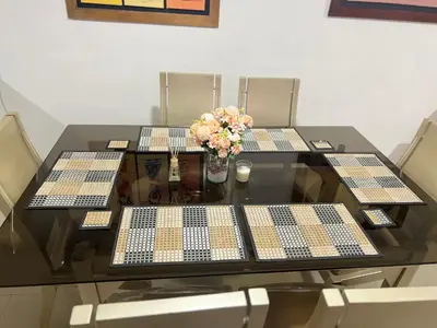 a table with four chairs with a console on it at Torres del lago de 2 habitaciones, 1201 in Cartagena de Indias