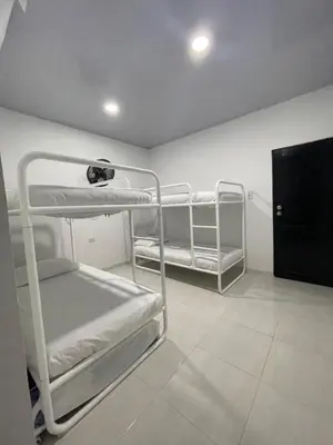 a room with two bunk beds in a room at HOTEL HOUSE San Antero Córdoba in San Antero