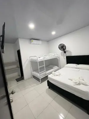 a room with a bed and a staircase in it at HOTEL HOUSE San Antero Córdoba in San Antero