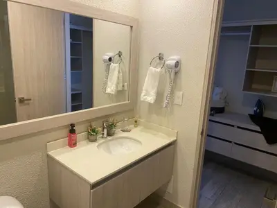 a bathroom with a sink and a mirror at Dominique Cartagena, Beautiful 2 Bedroom Apartment in Cartagena de Indias