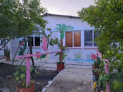 a house with a painting on the side of it at Mar Rosa Galerazamba Hostal in Galerazamba