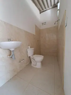 a bathroom with a toilet and a sink at Mar Rosa Galerazamba Hostal in Galerazamba