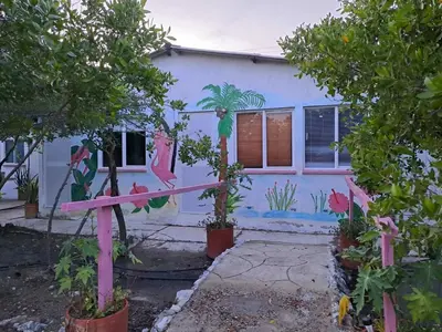 a house with a painting on the side of it at Mar Rosa Galerazamba Hostal in Galerazamba