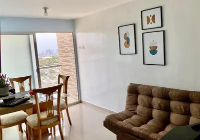 a living room with a couch and a table at Apartamento en Cartagena, Entero y Amueblado in Cartagena de Indias