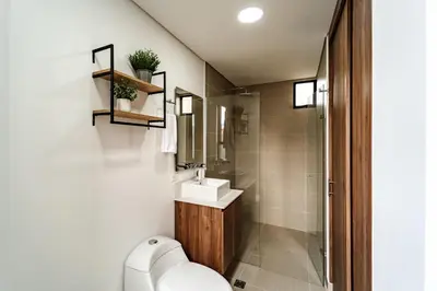 a bathroom with a toilet and a sink at Apartamento ubicado en, LAURELES, MEDELLIN in Cartagena de Indias