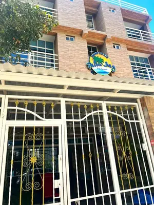 a building with a gate in front of it at SGH Hotel Palm Bay Bello Horizonte in Santa Marta