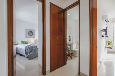 a room with a door leading to a bedroom at SkyMar Luxury 27 in Cartagena de Indias