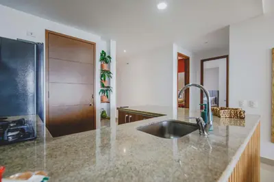 a kitchen with a sink and a counter top at Frente Al Mar Ciudad Antigua Home Office 14B in Cartagena de Indias