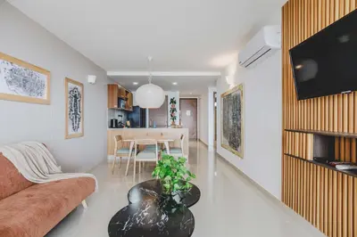 a living room with a couch and a table at Frente Al Mar Ciudad Antigua Home Office 14B in Cartagena de Indias