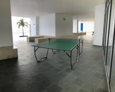 a ping pong table in the middle of a room at Frente al Mar home office 7B in Cartagena de Indias