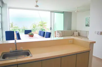 a kitchen with a sink and a large window at Magico Apartamento Frente al Mar 3 Habitaciones TR21 in Coveñas