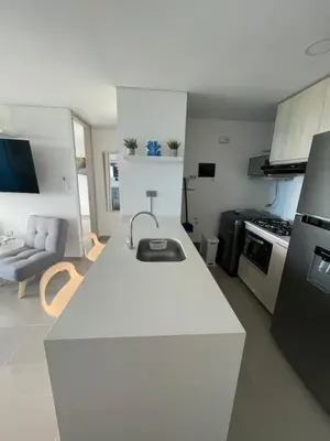 a kitchen with a white counter top in a room at Infinity Blue - Playa Dormida in Santa Marta
