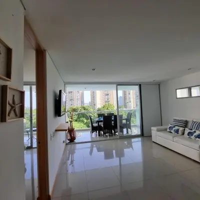 a living room with a table and a couch at Torres del Mar Santa Marta in Santa Marta