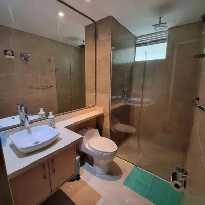 a bathroom with a toilet and a shower and a sink at Torres del Mar Santa Marta in Santa Marta