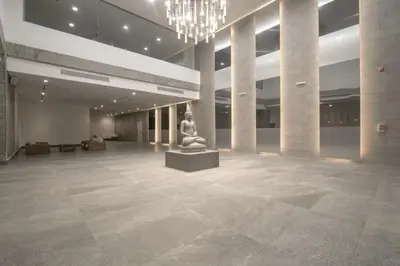 a large lobby with a statue in the middle at Great apartment in Bocagrande with sunset & beach view in Cartagena de Indias
