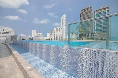 a swimming pool on the roof of a building at Great apartment in Bocagrande with sunset & beach view in Cartagena de Indias