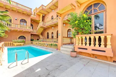 a house with a swimming pool and a balcony at 2CM-J1 APARTAMENTO DE 2 ALCOBAS CON VISTA Y PISCINA EN GETSEMANI in Cartagena de Indias