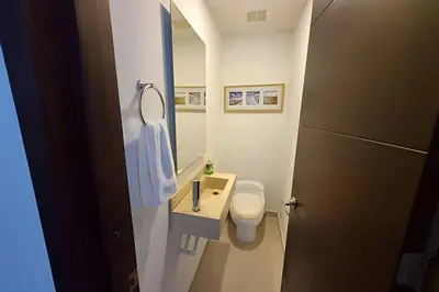 a bathroom with a toilet and a sink and a mirror at 2 Dormitorios Morros. Vista Mar y salida playa in Cartagena de Indias