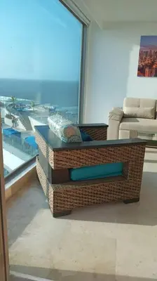 a living room with a coffee table in front of a window at Luxury apartment in Morros - Cartagena de Indias in Cartagena de Indias