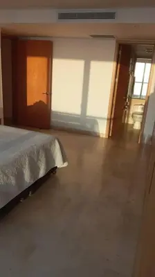 a bedroom with a bed and a hallway with a door at Luxury apartment in Morros - Cartagena de Indias in Cartagena de Indias