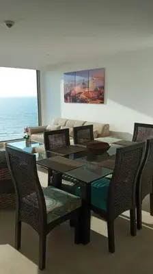 a dining room with a glass table and chairs at Luxury apartment in Morros - Cartagena de Indias in Cartagena de Indias