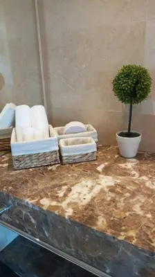 a room with towels and a potted plant on a counter at Luxury apartment in Morros - Cartagena de Indias in Cartagena de Indias