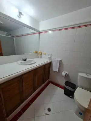 a bathroom with a sink and a toilet at Casa Blanca del Mar in Santa Marta