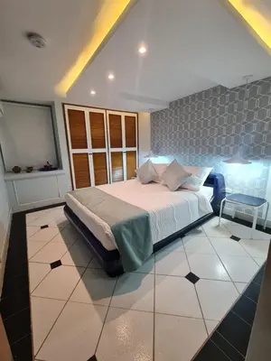 a bedroom with a large bed in a room at Casa Blanca del Mar in Santa Marta