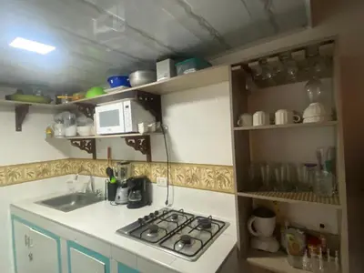 a kitchen with a sink and a stove top oven at 4CR-1M CASA DE 4 HABITACIONES EN EL CENTRO HISTORICO, GETSEMANI in Cartagena de Indias