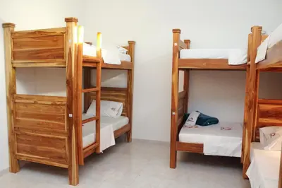a room with three bunk beds in a room at Hostal Casa Torres Centro Historico - Adults Only in Cartagena de Indias